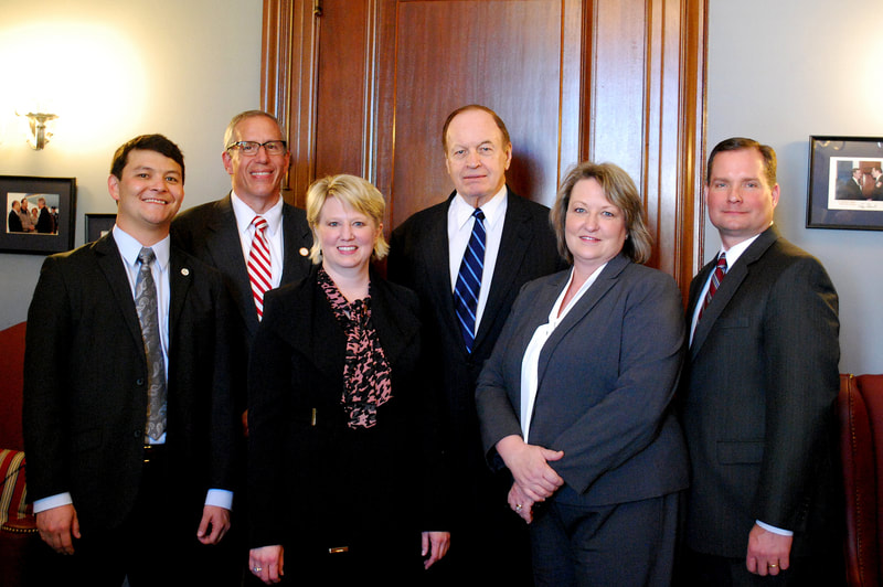 Members of the Education Policy Center are seen.