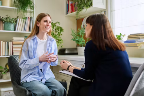 A student discusses something with an advisor.